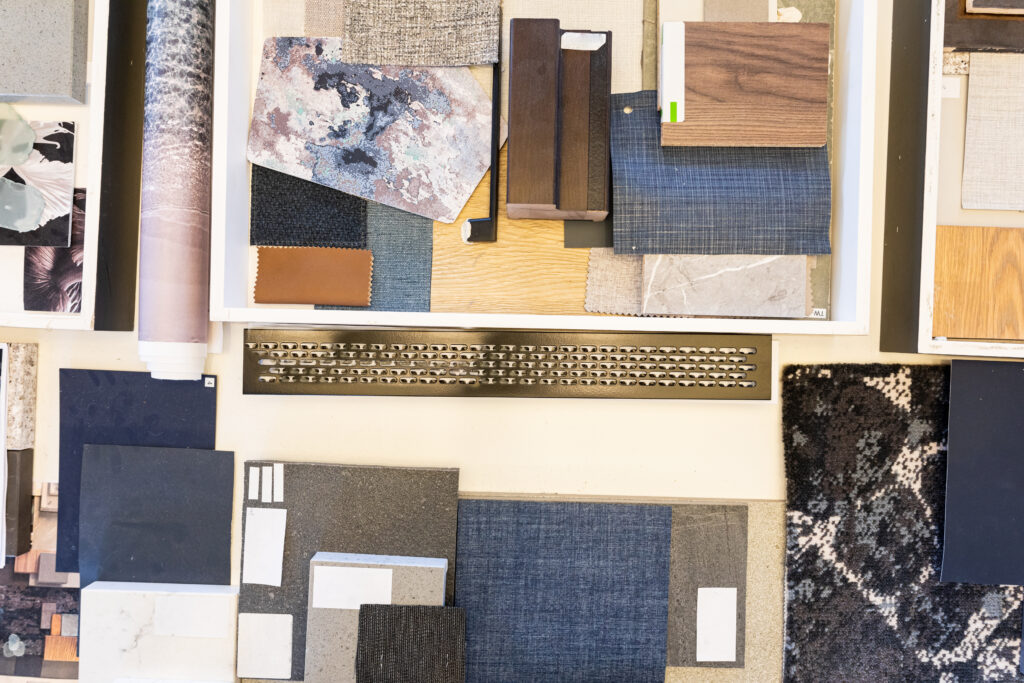 Overhead view of various patterned fabric swatches on table in office. unaltered, business and creative office.