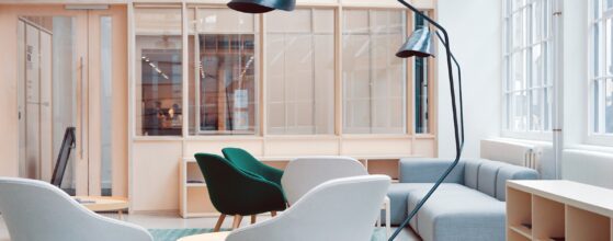 Architect's desk with scale model, drawings, and tools for project planning
