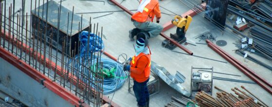 Aerial view of an active construction site with workers and equipment