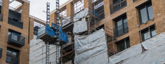 Building exterior wrapped in scaffolding during renovation construction work