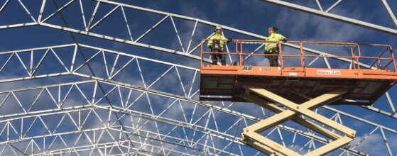 Construction workers on a steel framed building site during the workday