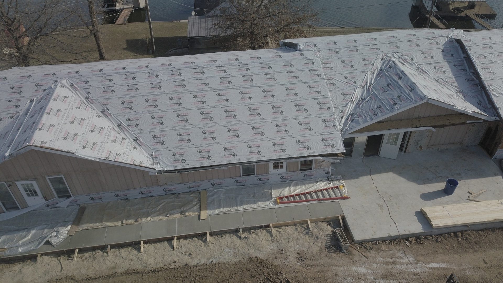 Aerial view of Crosspointe Camp building renovation beside the lake in Rocky Mount, MO