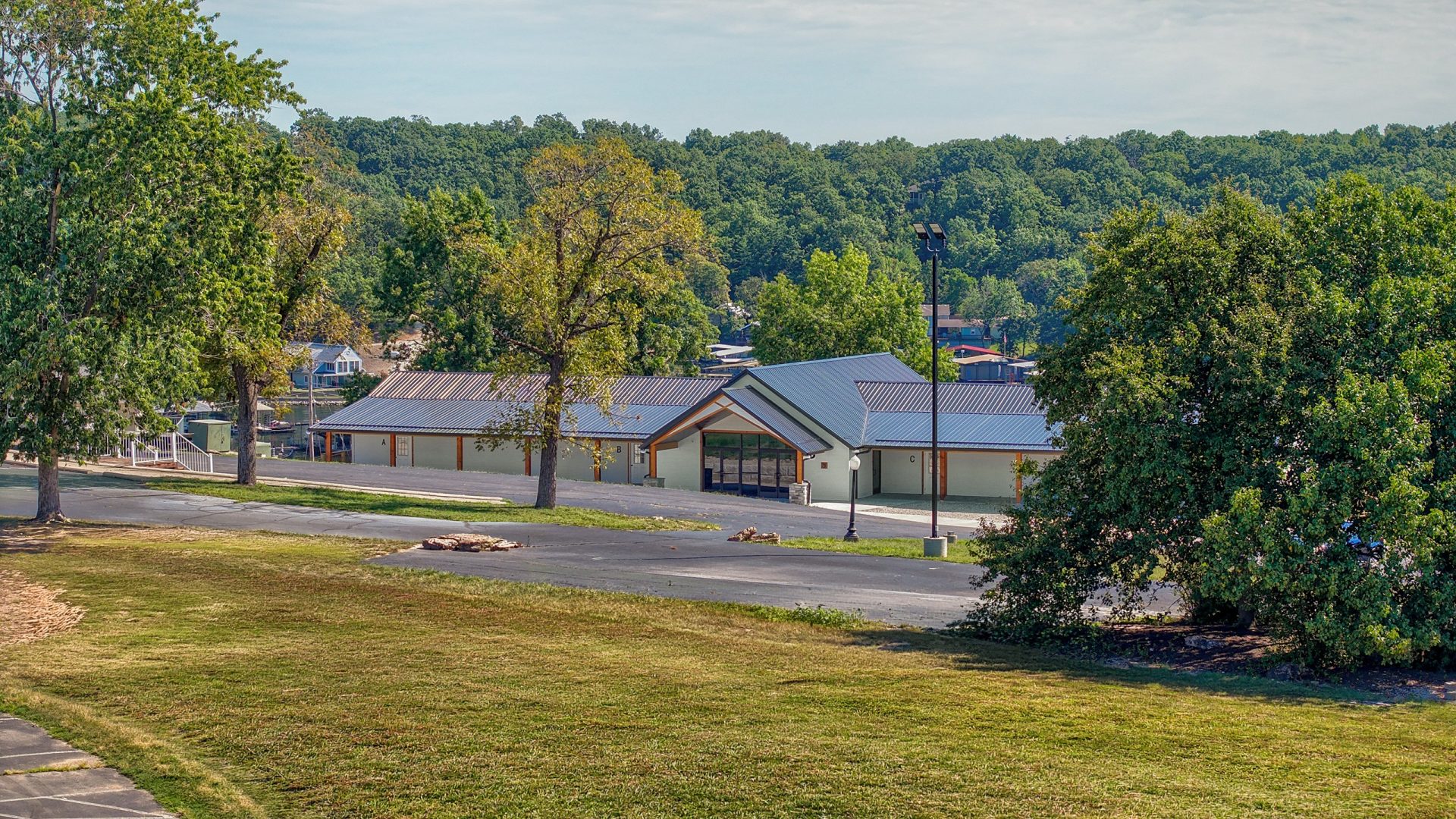 Exterior of Crosspointe Camp building near the lake in Rocky Mount, MO