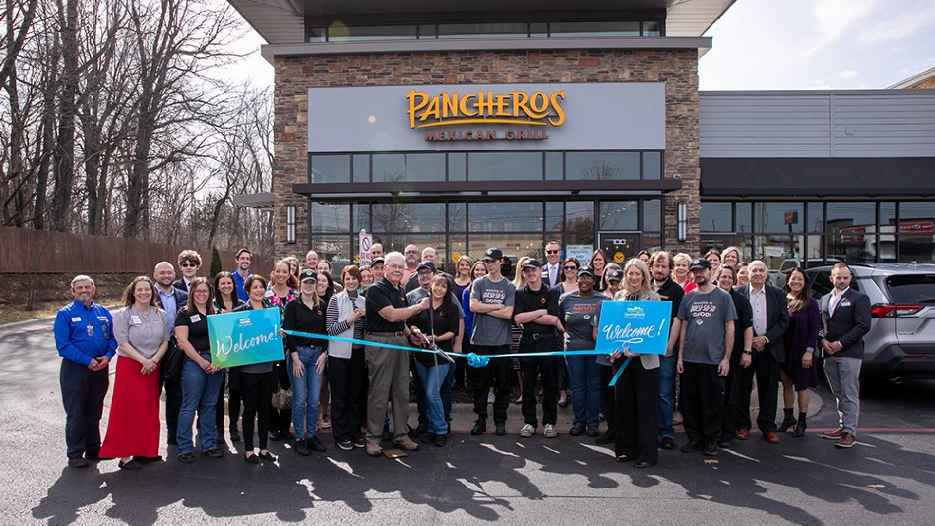 Ribbon cutting in front of Pancheros Mexican Grill exterior in Springfield MO