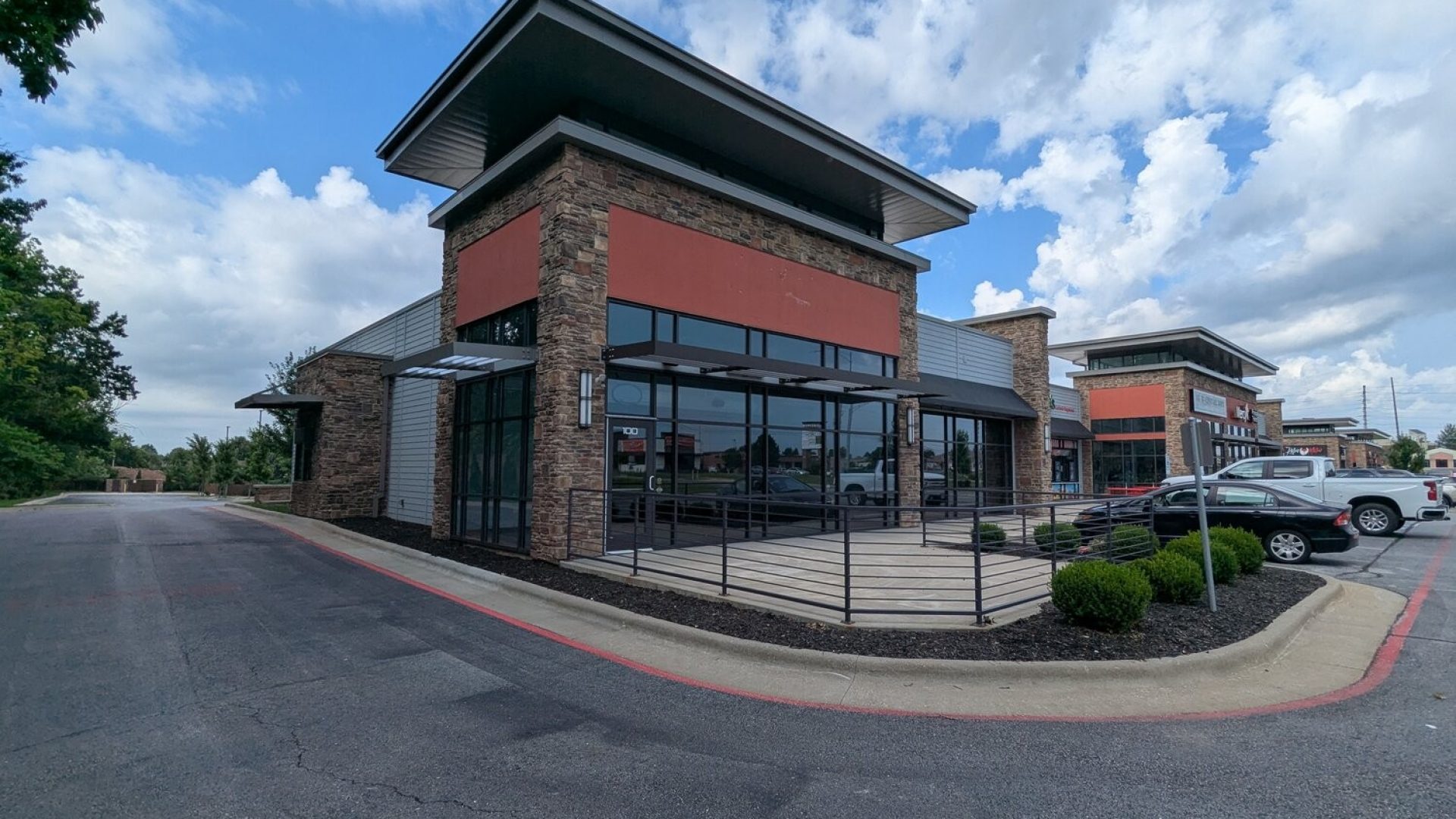 Exterior of a modern stone and glass fast-casual restaurant building in Springfield MO