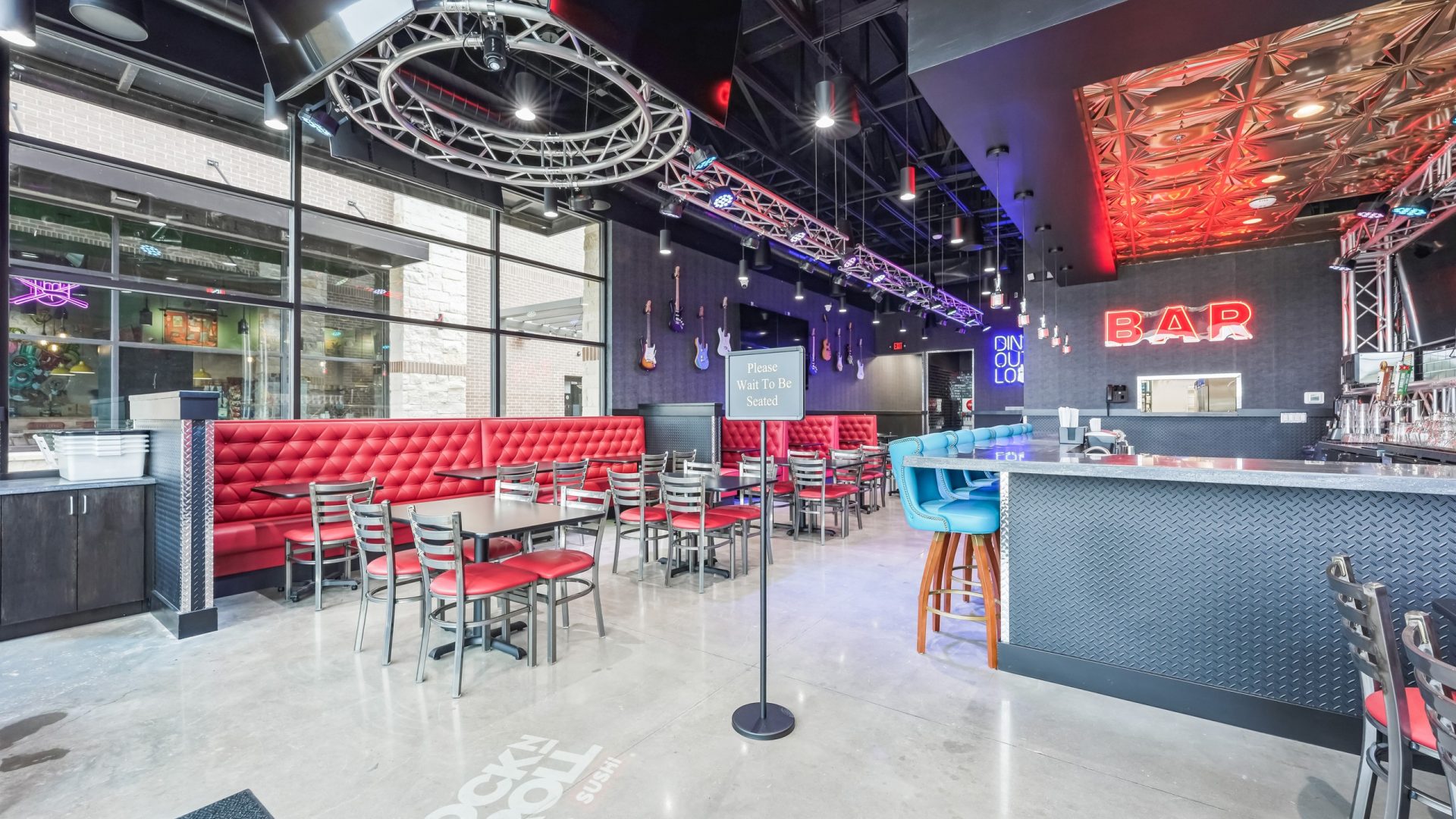 Dining room and bar inside Rock N Roll Sushi in Mansfield, TX