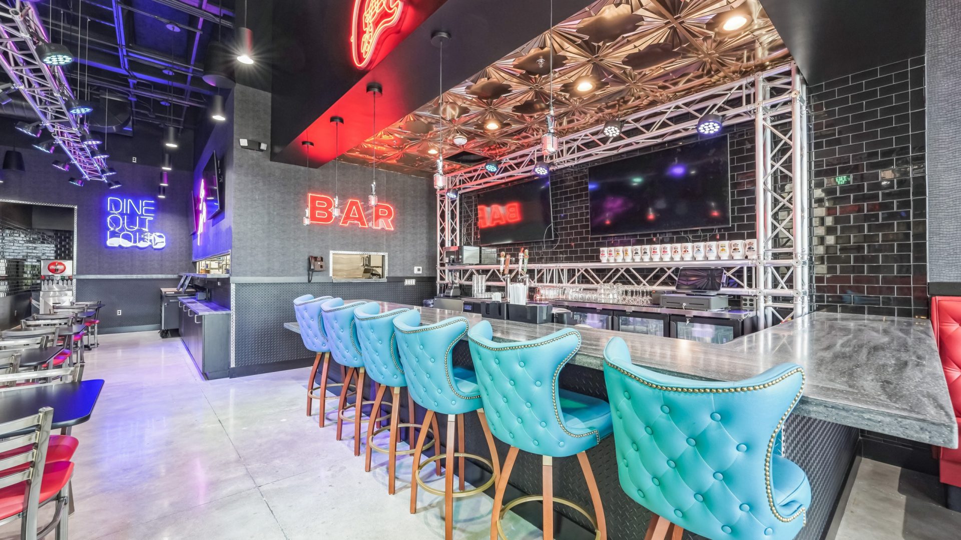 Bar interior of Rock N Roll Sushi in Mansfield, TX with neon signs