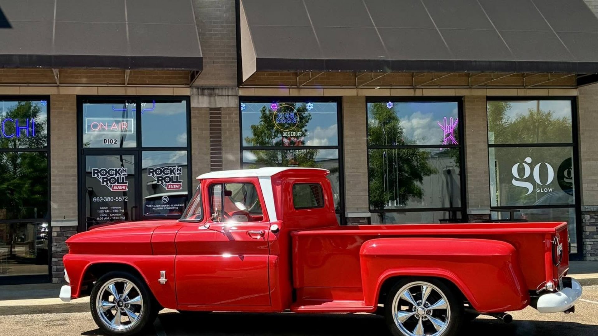 Rock N Roll Sushi storefront in Oxford, MS with red classic truck parked out front
